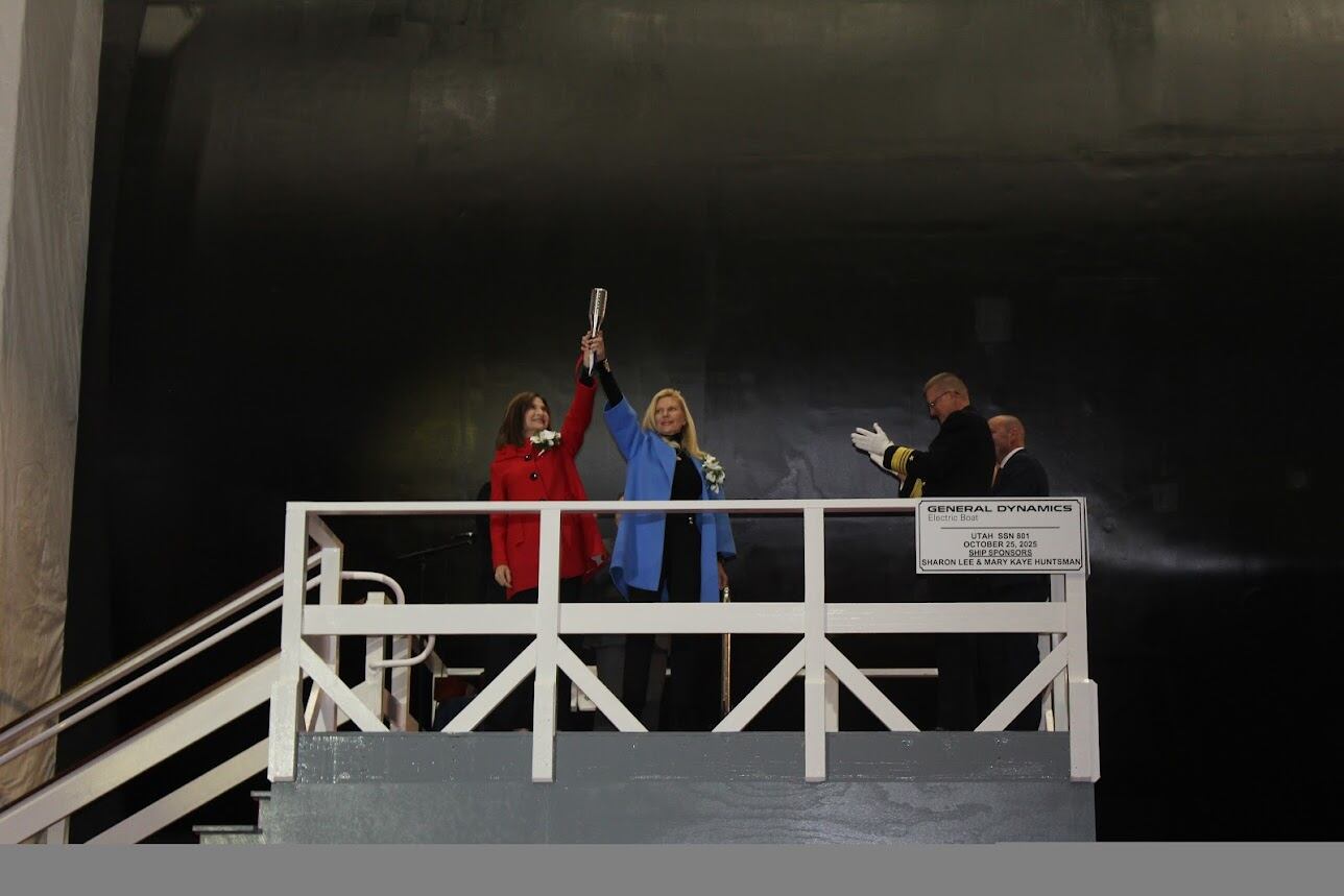 USS Utah co-sponsors Mary Kay Huntsman and Sharon Lee stand together at the christening ceremony for the Virginia class submarine on Oct. 25, at the General Dynamics Electric Boat Shipyard in Groton, Conn.