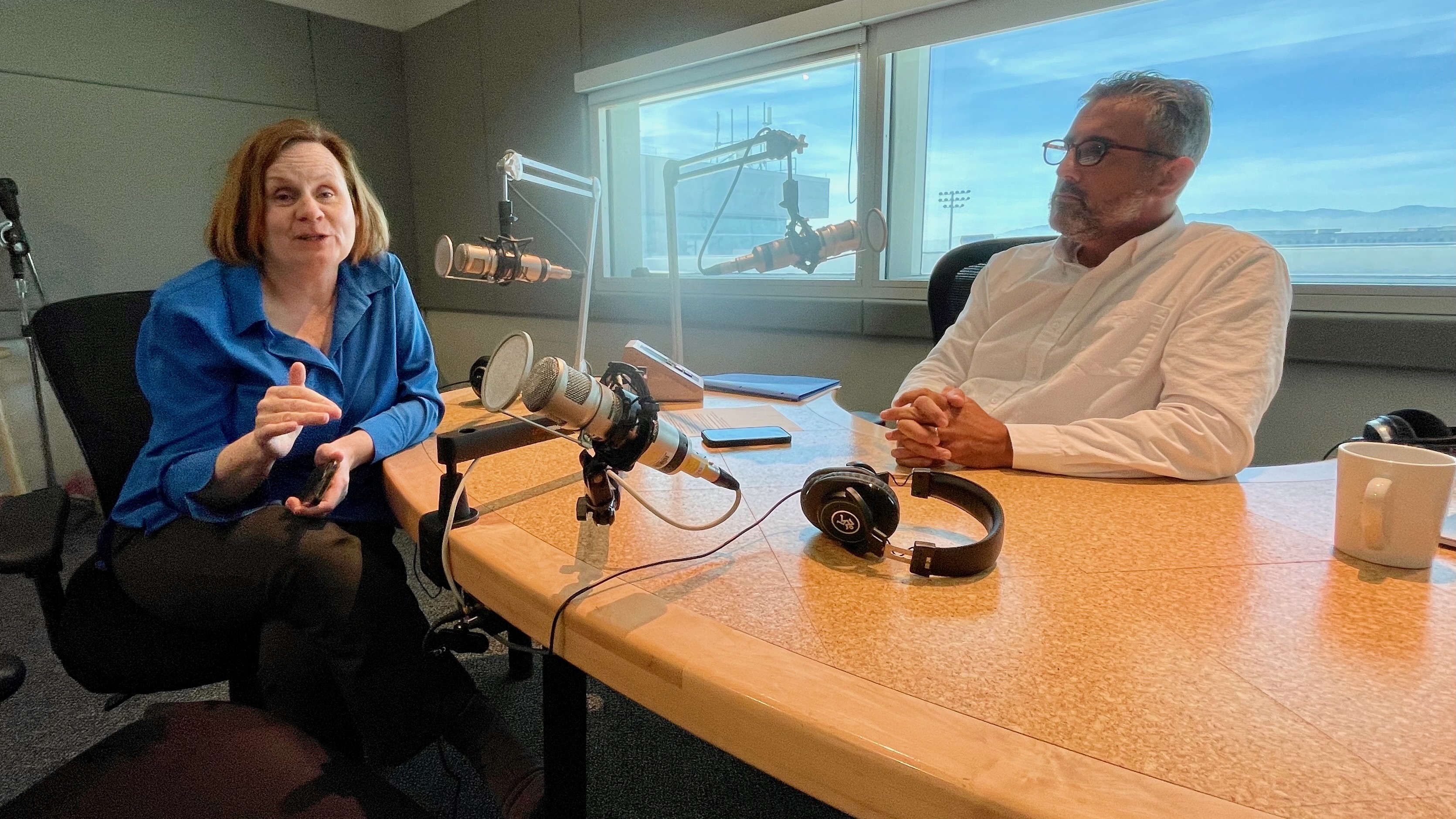Avanza Executive Director Maria O'Mara discusses the new radio station at its offices on the University of Utah campus in Salt Lake City on Monday with Pablo Tellechea.