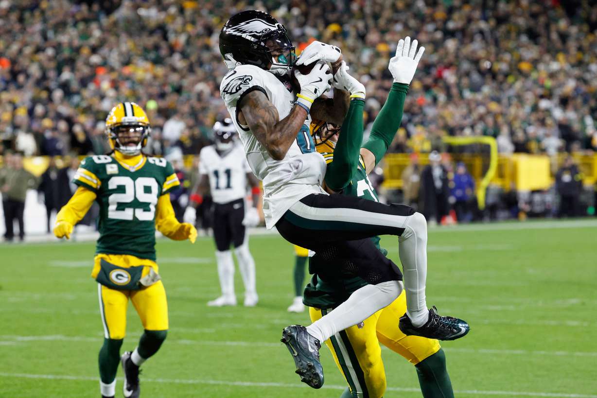 Philadelphia Eagles wide receiver DeVonta Smith (6) catches a pass for a touchdown against the Green Bay Packers during the second half of an NFL football game Monday, Nov. 10, 2025, in Green Bay, Wis.