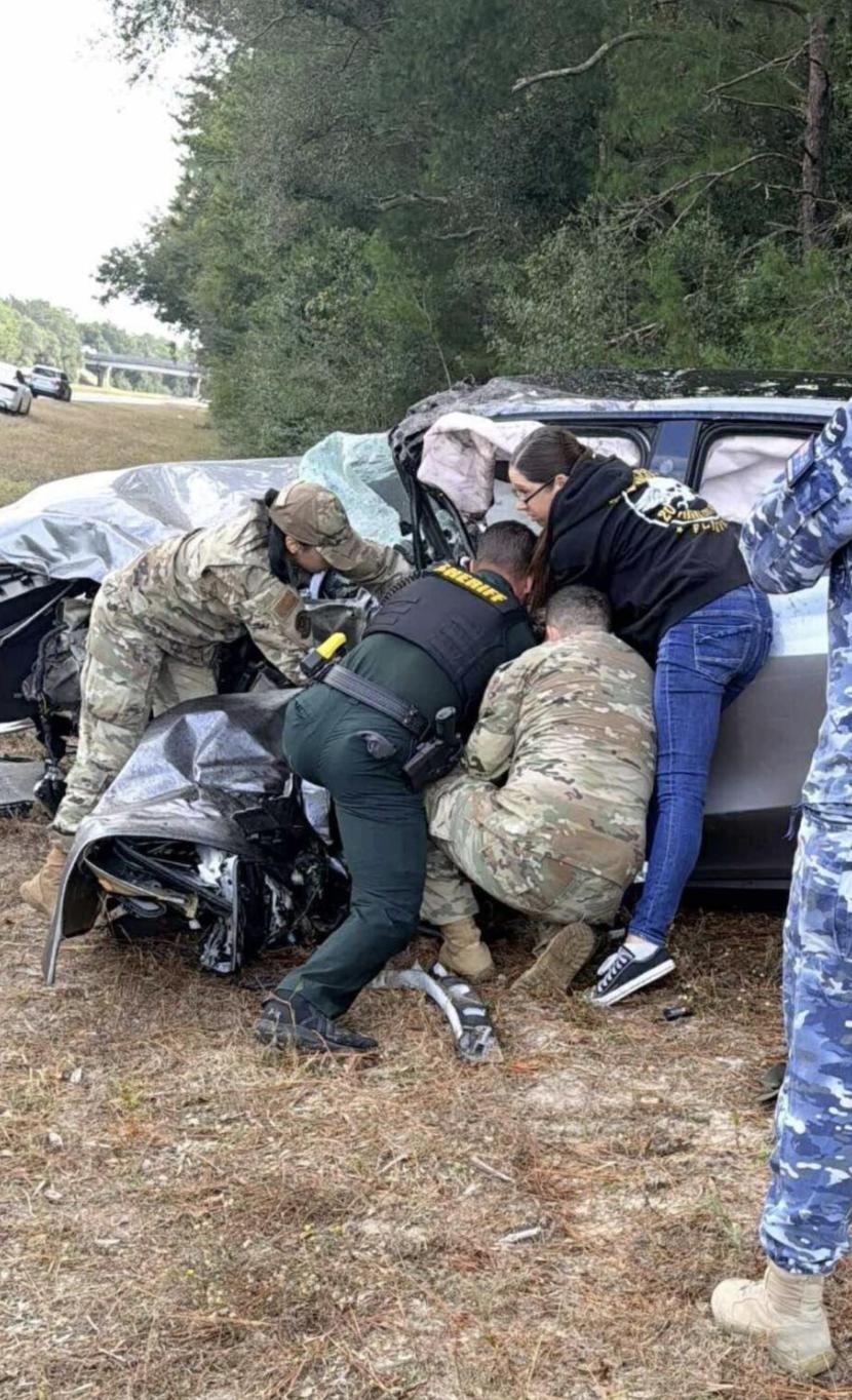First responders and airmen work to help Tamra Kendrick after she crashed head-on into another vehicle in Florida on Nov. 7. The 61-year-old Utah woman is in critical condition at a Florida hospital, and her family is now holding onto hope and praying for a miracle.