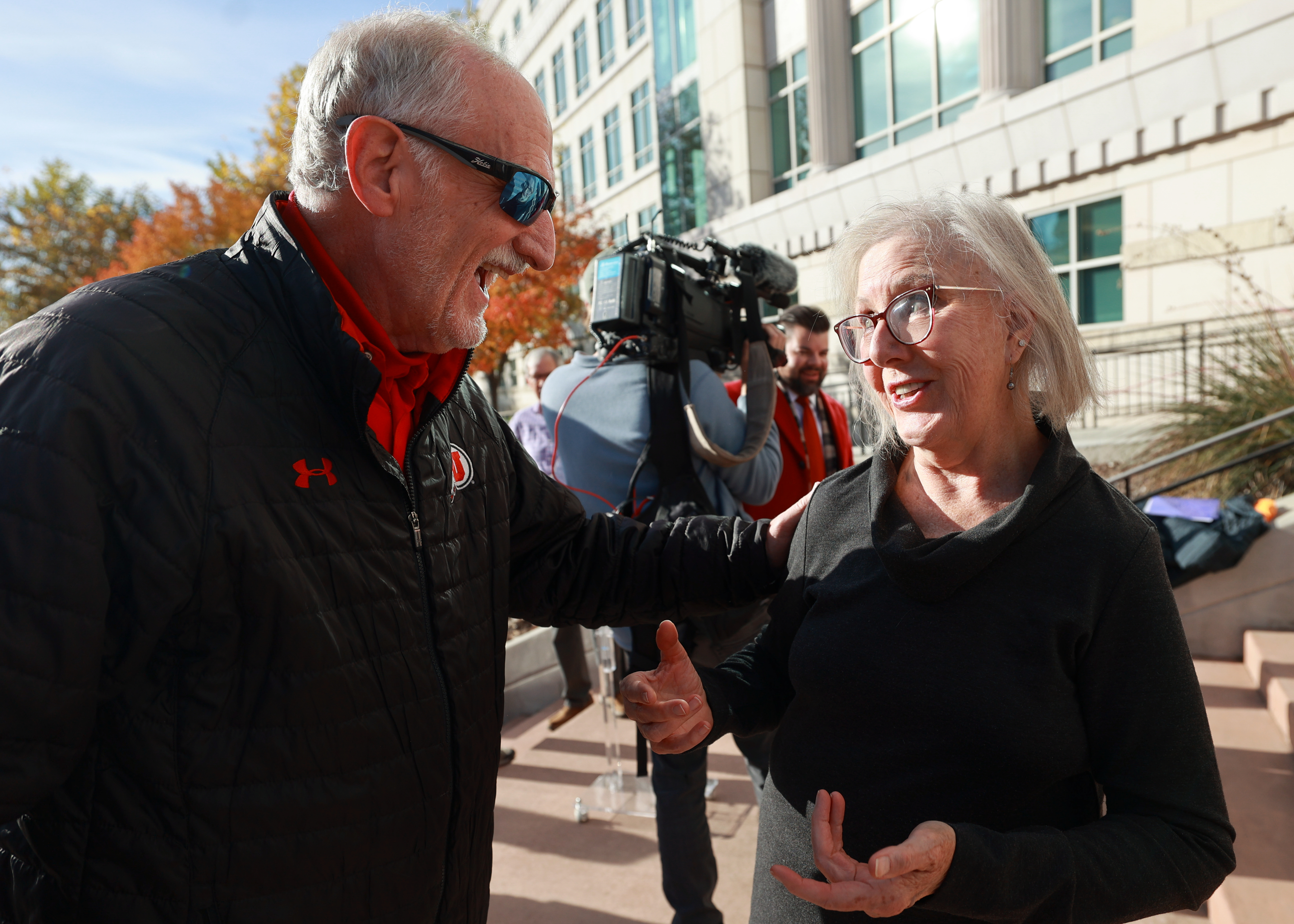 Tim Chambless, Better Boundaries board member and former chair, talks with Katharine Biele, League of Women Voters of Utah president, at a press conference with Better Boundaries, League of Women Voters and Mormon Women for Ethical Government, after a judge rejected the Utah Legislature’s congressional map outside of the 3rd District Courthouse in Salt Lake City on Tuesday.