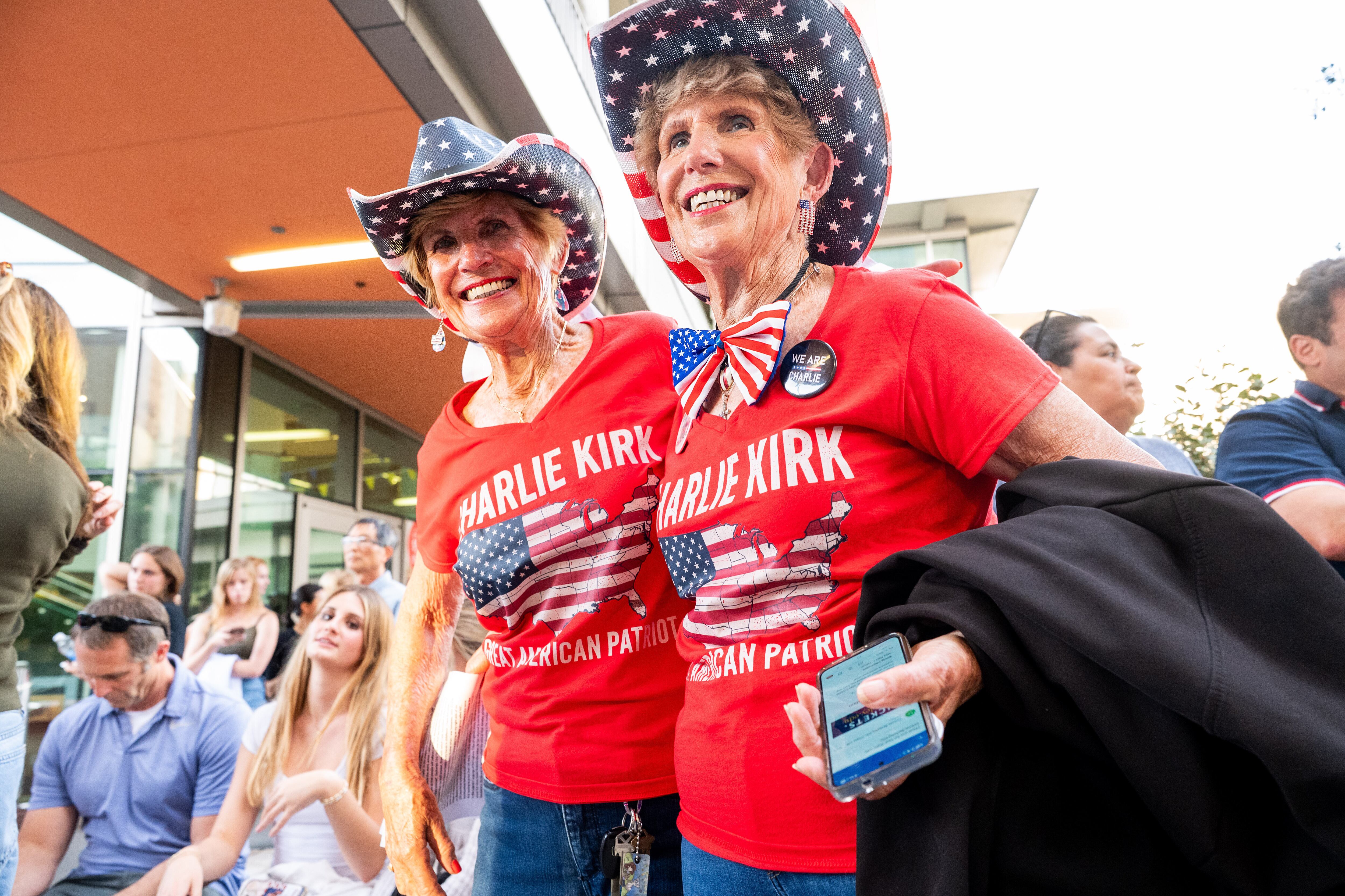 Sisters "Fun Mary" Pelican, right, and "Fun Carol" Goedde wait to get into a Turning Point USA event at the University of California, Berkeley on Tuesday, in Berkeley, Calif. The event was well-attended despite protests that took place.