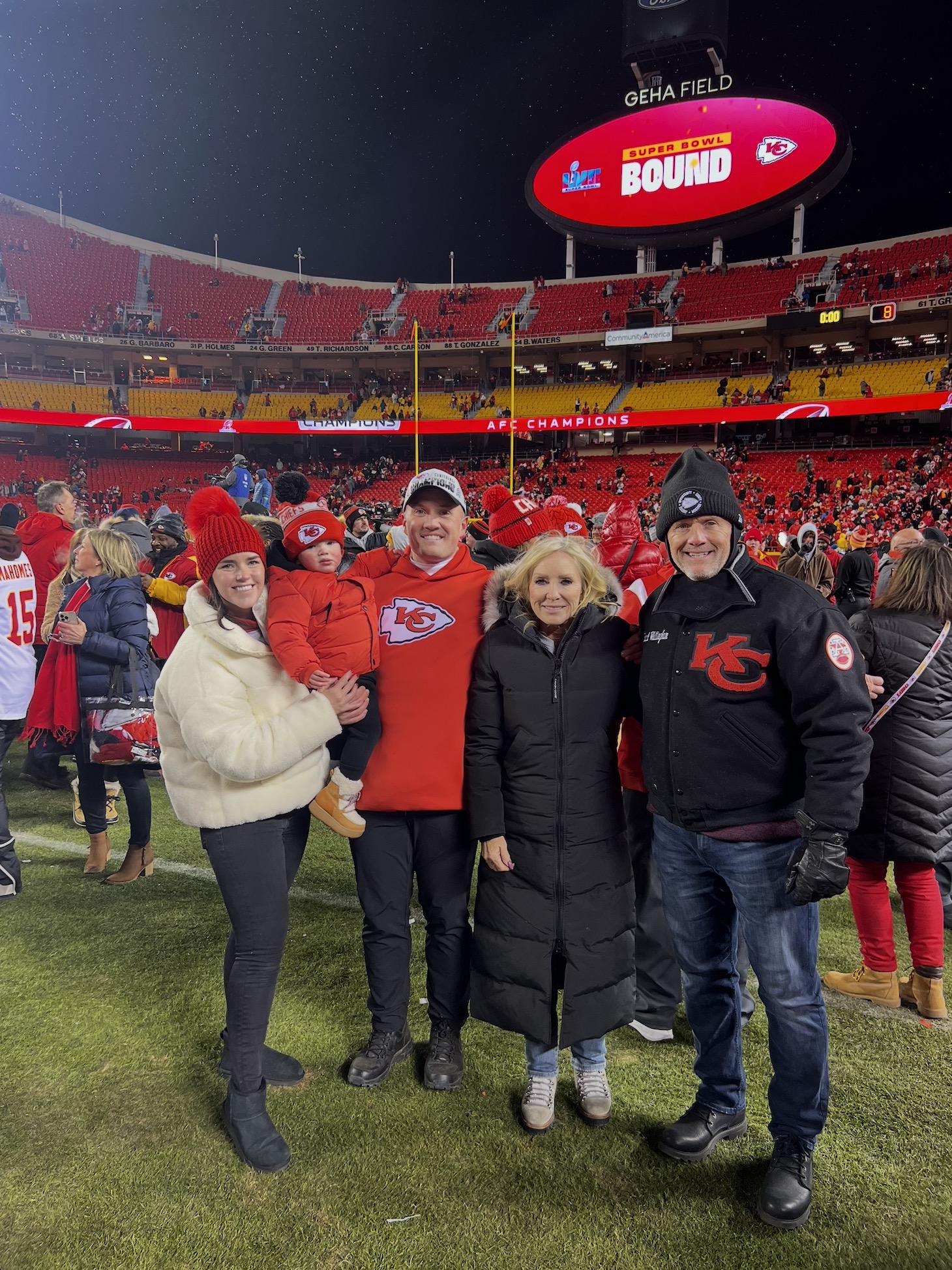 The Whittingham family pose on the field in Kansas City after the Chiefs qualified for the Super Bowl.