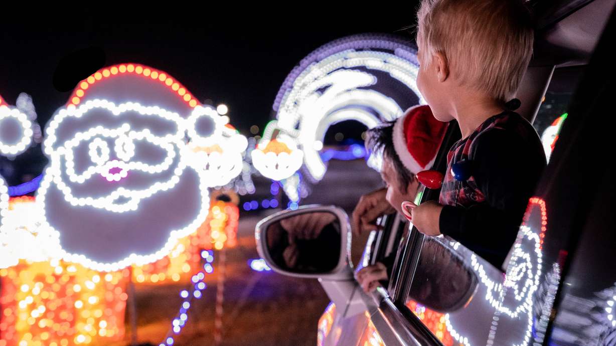 A child looks at Christmas lights at Christmas in Color's drive-thru light display. The attraction returns for the 2025 season on Friday.