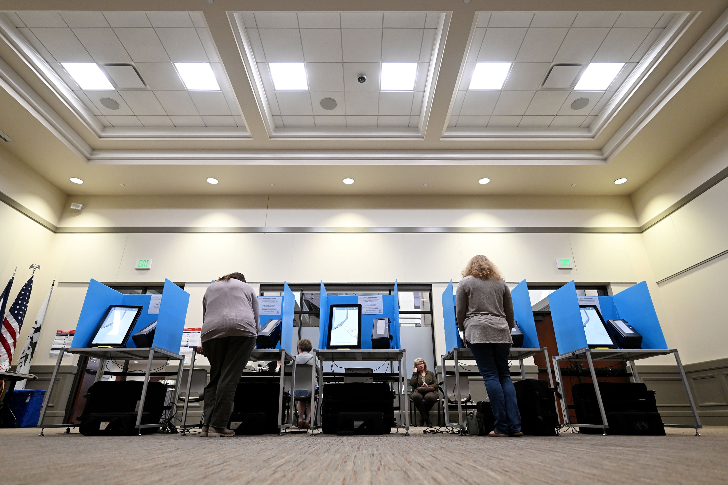 Bea Lunde, of Herriman, and Elisaberth Woodruff, of Herriman, stand at the voting machines and vote at Herriman City Hall on Nov. 4.