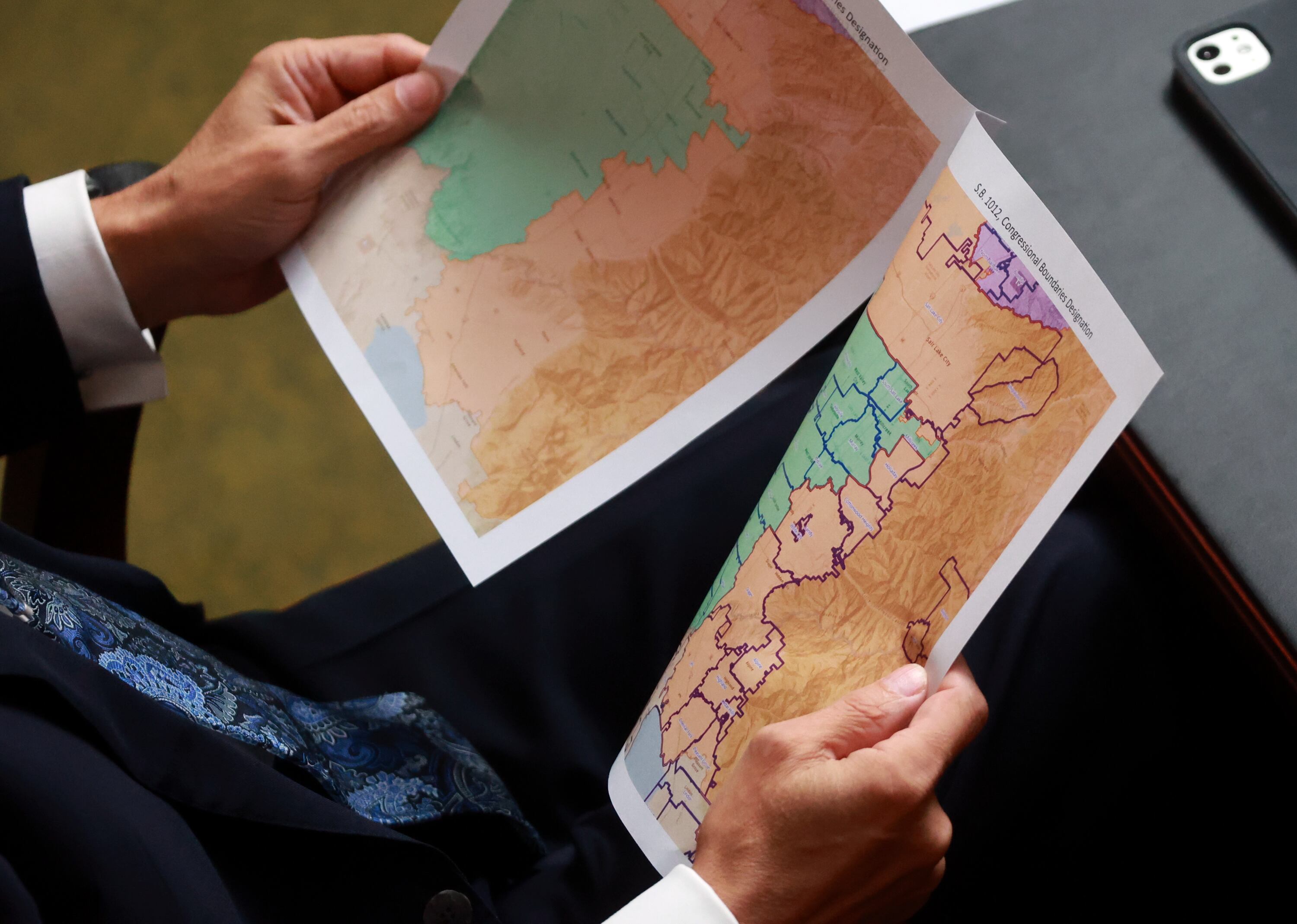 A representative looks at proposed maps during discussions of SB1012 Congressional Boundaries Designation in the House chamber at the Capitol in Salt Lake City on Oct. 6.