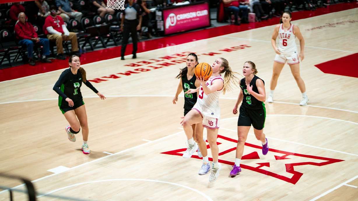 Brooke Walker drives in for a layup in Utah's win over Utah Valley.
