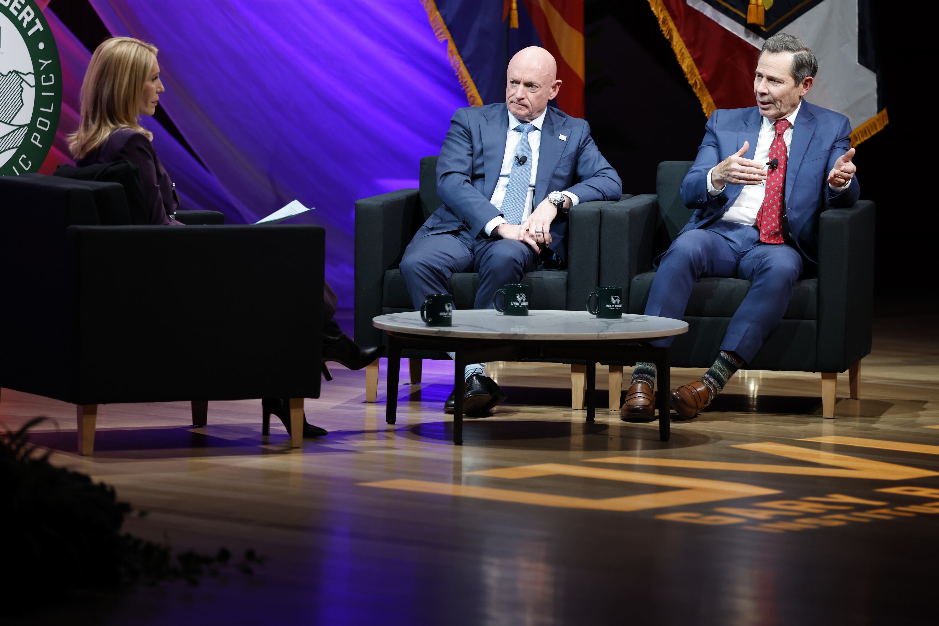 CNN's Dana Bash, left, speaks with Arizona Sen. Mark Kelly and Utah Sen. John Curtis during a CNN town hall in the Noorda Center at Utah Valley University in Orem on Wednesday.