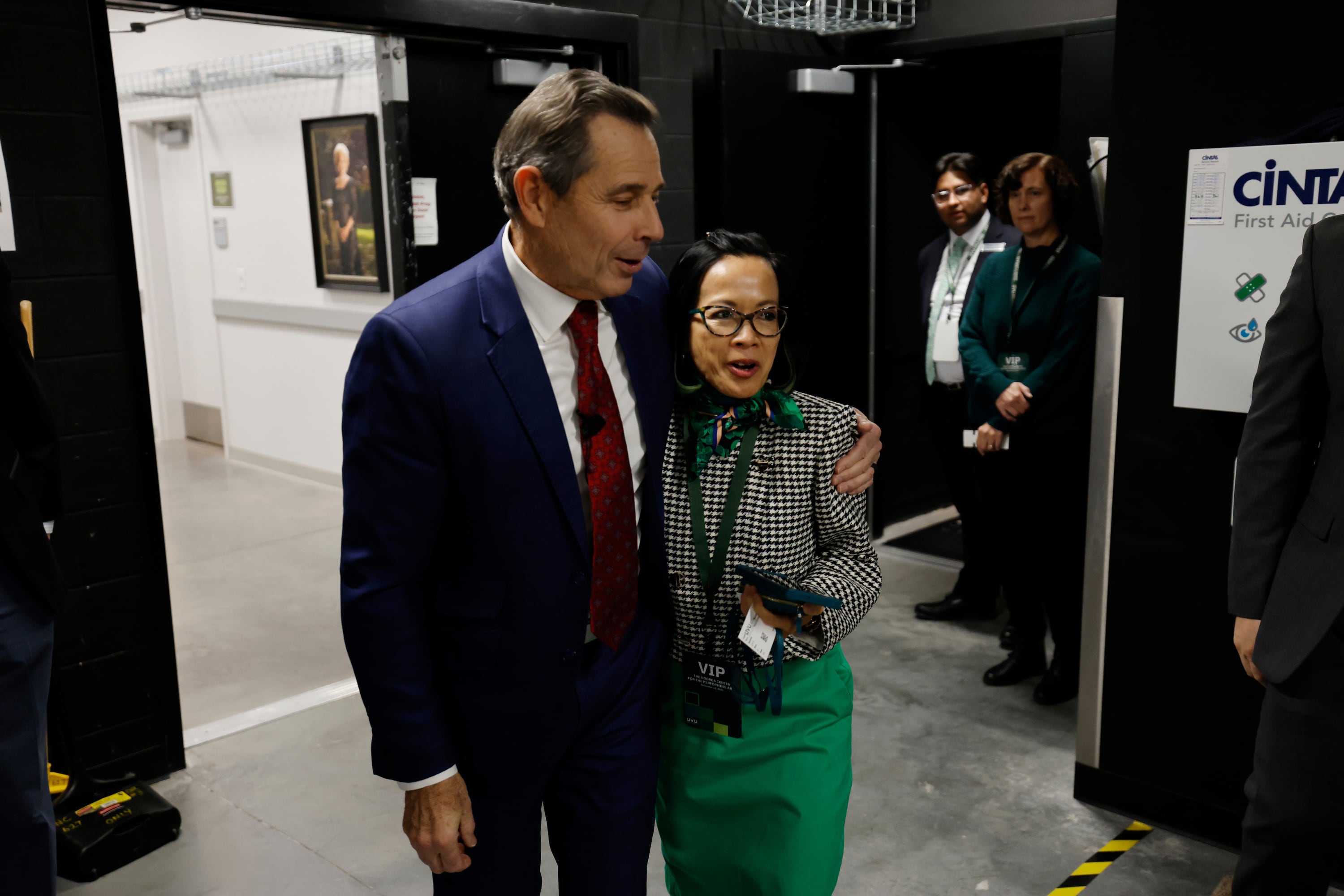 Utah Sen. John Curtis hugs Utah Valley University President Astrid Tuminez before he and Arizona Sen. Mark Kelly participate in a CNN town hall hosted by Dana Bash in the Noorda Center at Utah Valley University in Orem on Wednesday. Curtis said solving political violence won't be through playing the blame game.