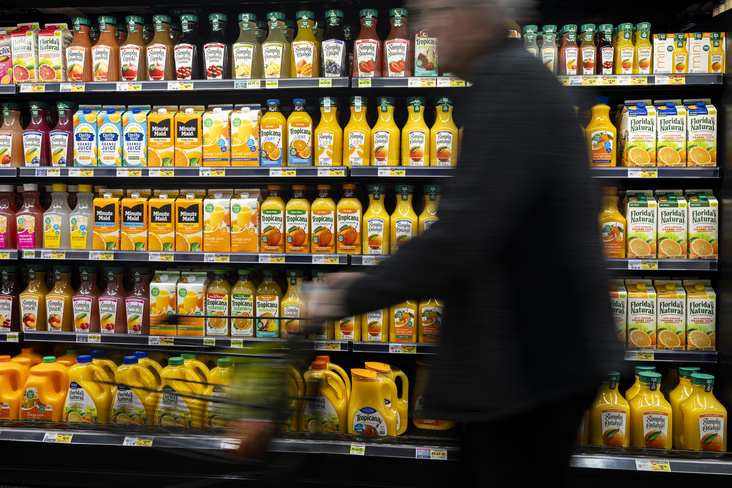 A shopper passes by orange juice at Dan's Market in Salt Lake City on Wednesday. Utah SNAP customers will receive their full November benefits with the reopening of the federal government after its longest shutdown in history.