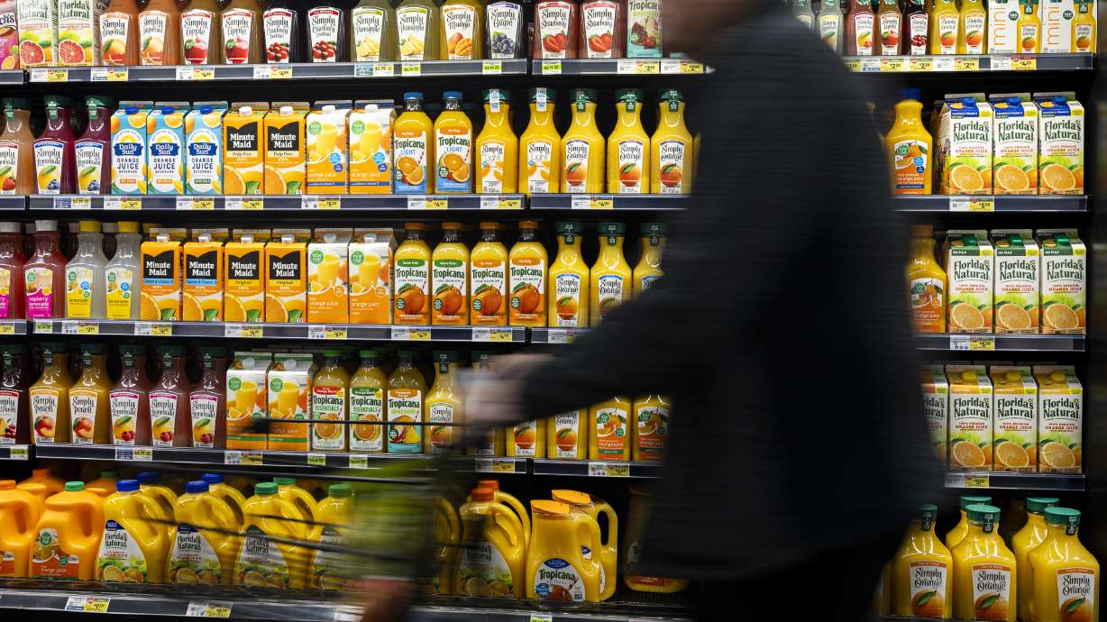 A shopper passes by orange juice at Dan's Market in Salt Lake City on Wednesday. Utah SNAP customers will receive their full November benefits with the reopening of the federal government after its longest shutdown in history.