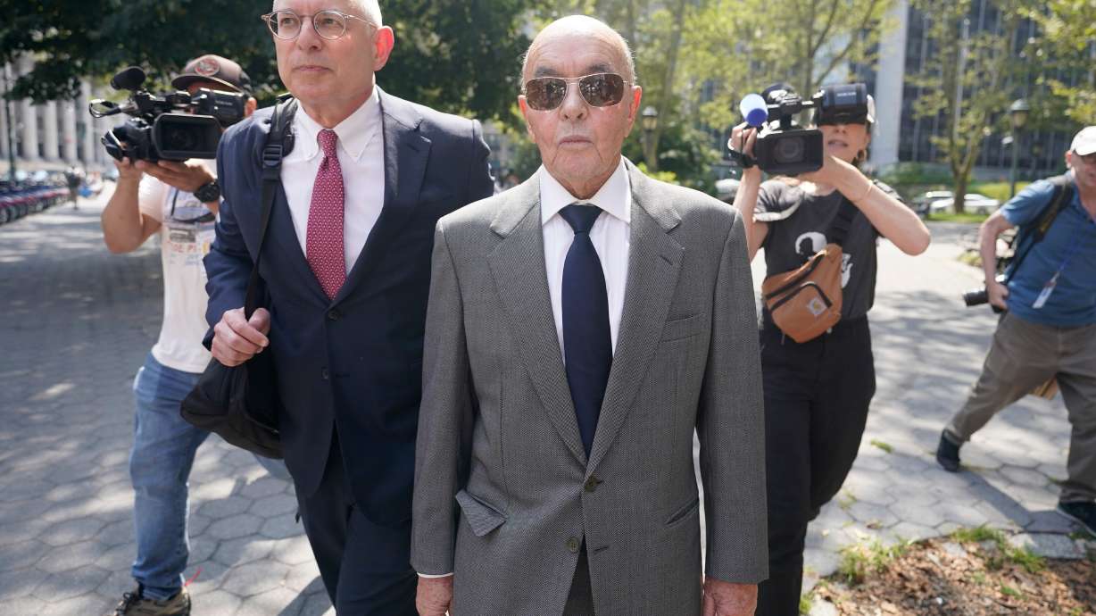 FILE - British billionaire Joe Lewis leaves, center, Manhattan federal court, July 26, 2023, in New York.