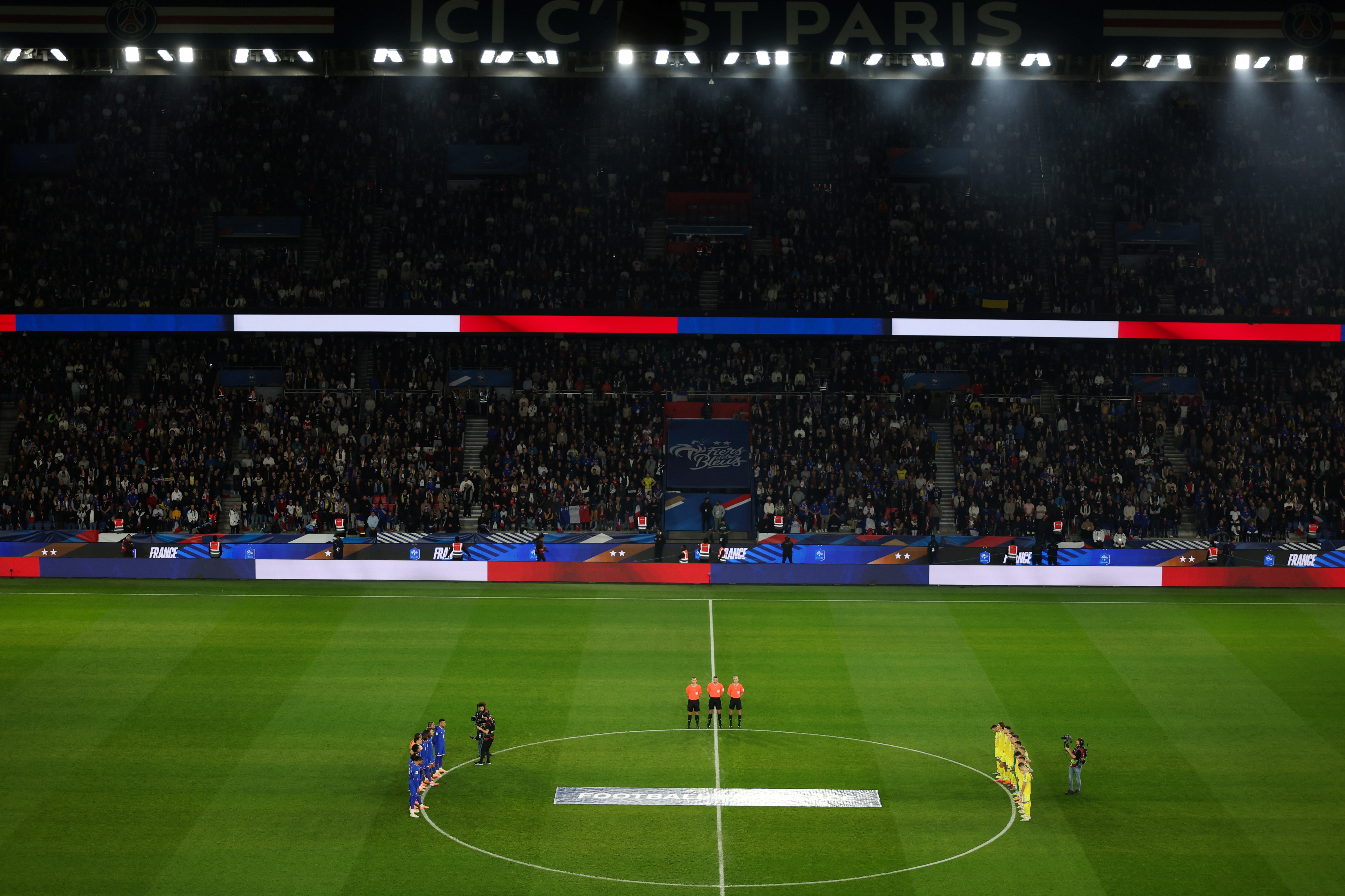 Players and fans remember victims of 2015 Paris terror attacks before France-Ukraine soccer match