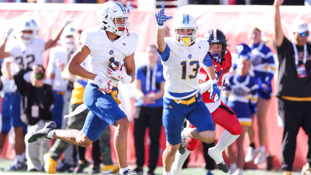 Orem's Kaue Akana (13) celebrates a big play against West in a 5A semifinal football game at Rice-Eccles Stadium in Salt Lake City on Thursday, Nov. 13, 2025.