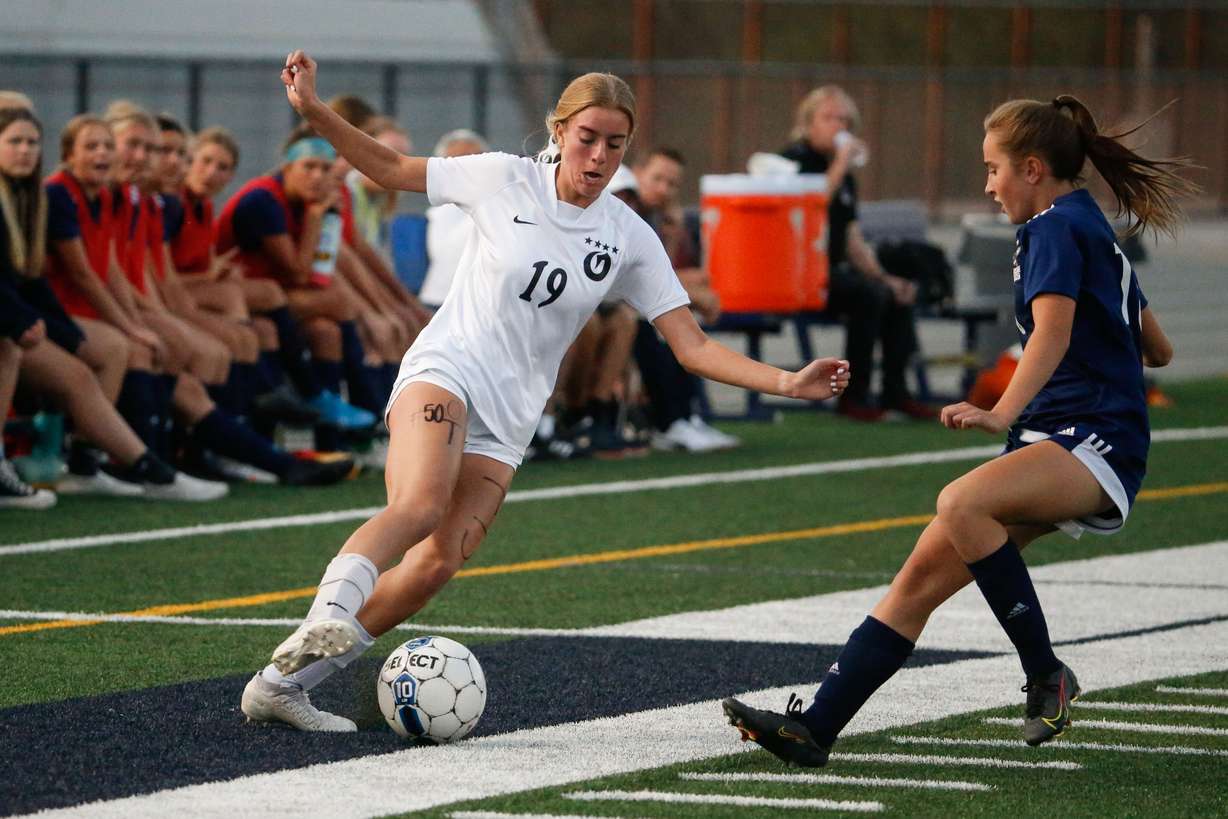 Olympus’ Millie Wilcox, left, moves the ball away from Skyline’s Annie Boyden as they compete in a high school girls soccer game at Skyline High School in Salt Lake City on Thursday, Sept. 16, 2021.