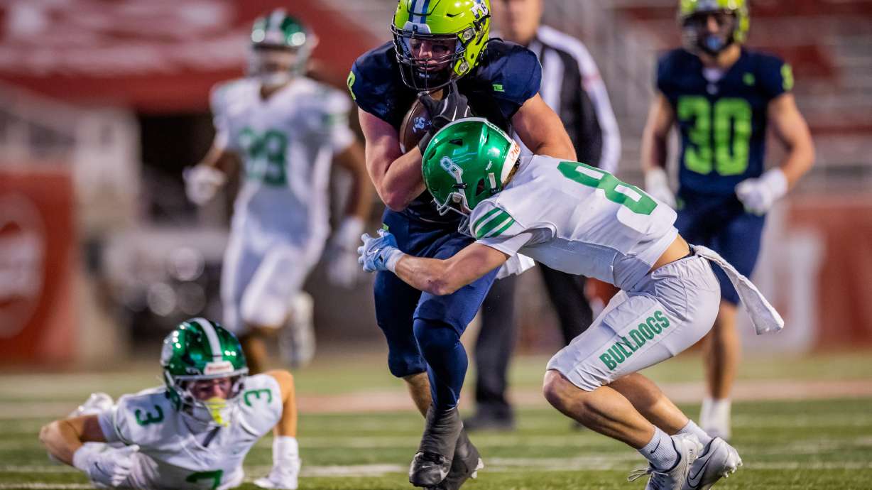 Ridgeline Riverhawks Hunter Knighton (0) runs down the field during a 4A semifinal high school football game against the Provo Bulldogs at Rice-Eccles Stadium in Salt Lake City on Thursday, Nov. 13, 2025.