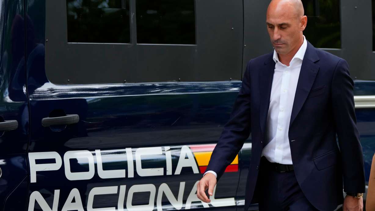 FILE - The former president of Spain's soccer federation Luis Rubiales passes a police van as he leaves after testifying at the National Court in Madrid, Spain,Sept. 15, 2023.
