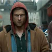 Review: 'The Running Man' is a neon-drenched, '80s throwback that knows exactly what it is