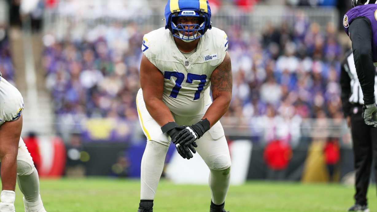 FILE - Los Angeles Rams offensive tackle Alaric Jackson (77) gets in position during the first half of an NFL football game against the Baltimore Ravens, Oct. 12, 2025, in Baltimore.