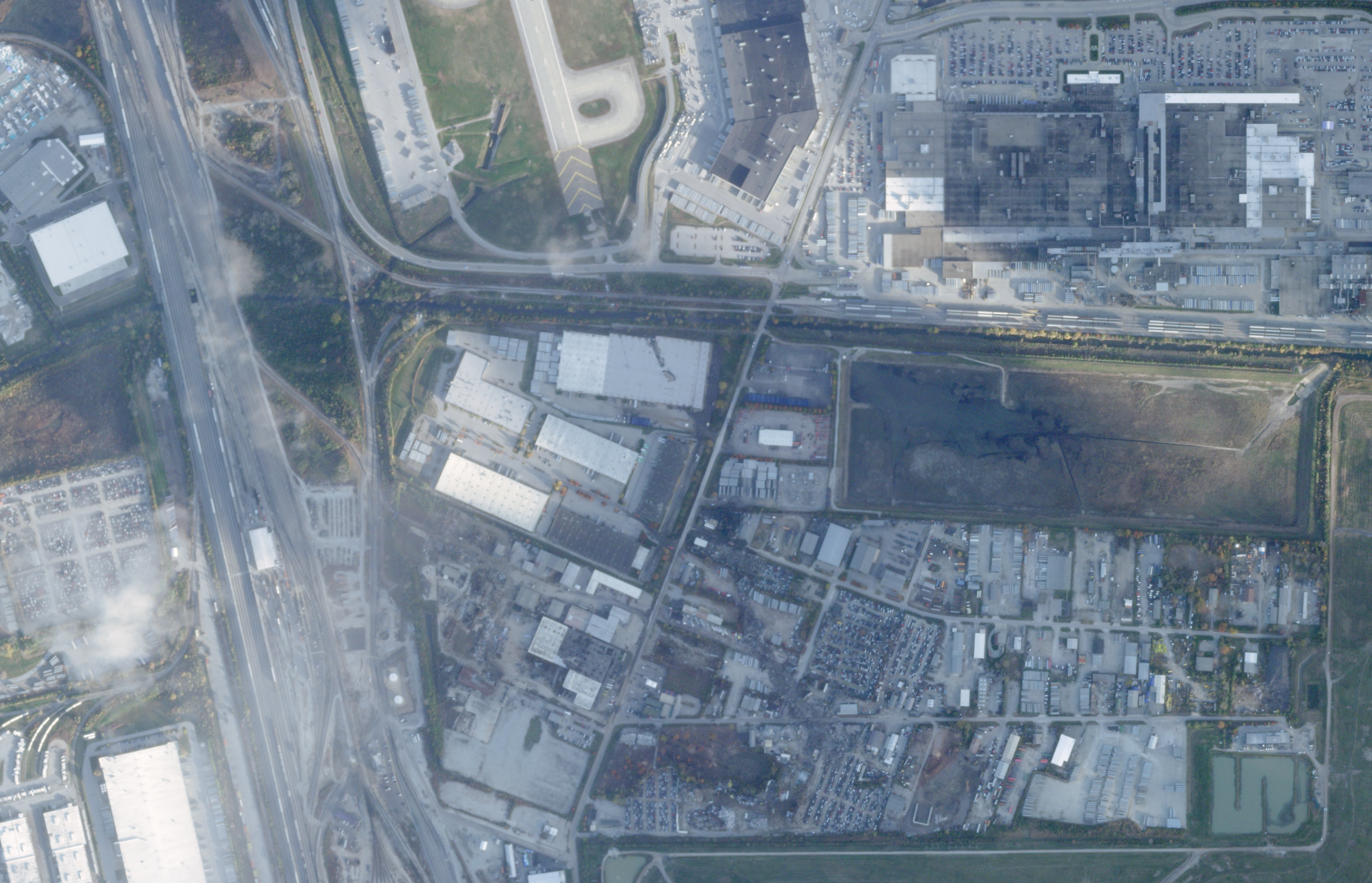 This satellite image from Planet Labs PBC shows the crash site of a UPS McDonnell Douglas MD-11 aircraft just south of Muhammad Ali International Airport, in Louisville, Ky., Monday.