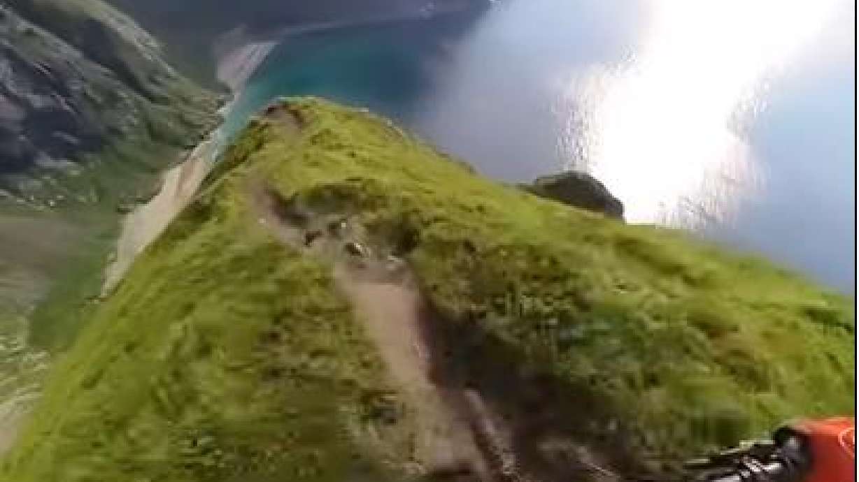 A mountain biker rides a risky ridge in Ryten, Norway, Sept. 27.