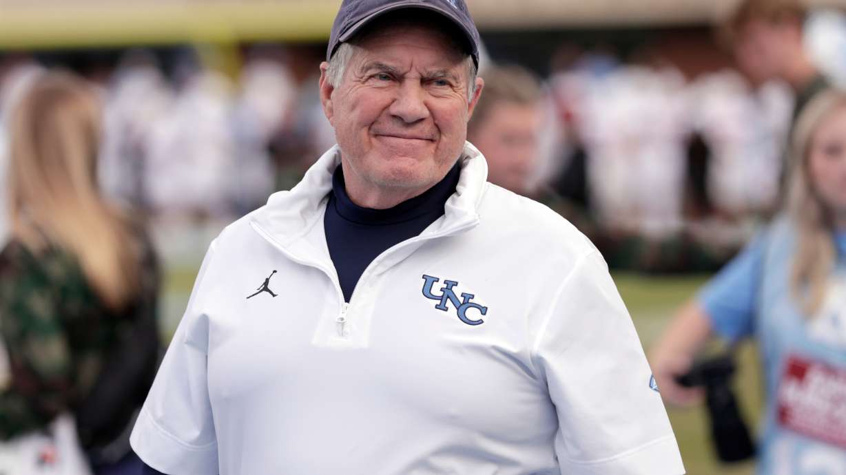 North Carolina head coach Bill Belichick smiles as he walks the sidelines before an NCAA college football game against Stanford, Saturday, Nov. 8, 2025, in Chapel Hill, N.C.