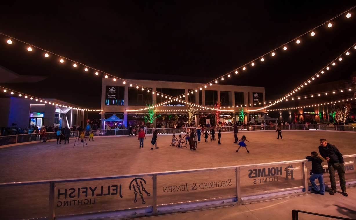 Families skate at the rink at America First Square in South Jordan on Friday.