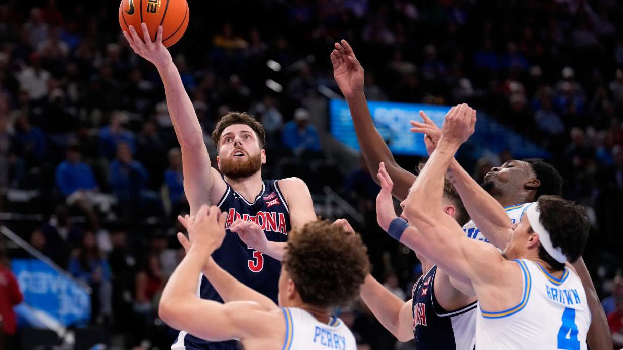 Arizona guard Anthony Dell'Orso (3) shoots as UCLA guard Trent Perry (0) defends during the first half of a Hall of Fame Series college basketball game Friday, Nov. 14, 2025, in Inglewood, Calif.