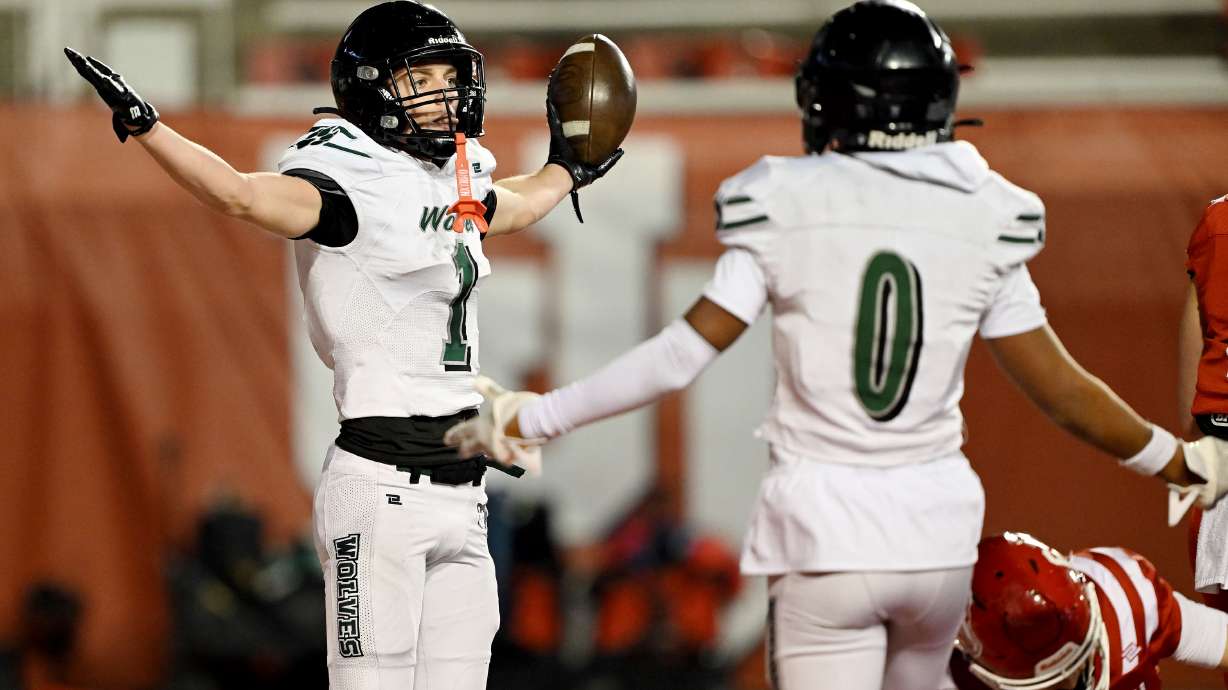 Green Canyon’s Cody Edelmayer holds out his arms and the ball after scoring a touchdown as they and Crimson Cliffs play in 4A semifinal football action in Rice-Eccles Stadium at the University of Utah in Salt Lake City on Friday, Nov. 14, 2025.