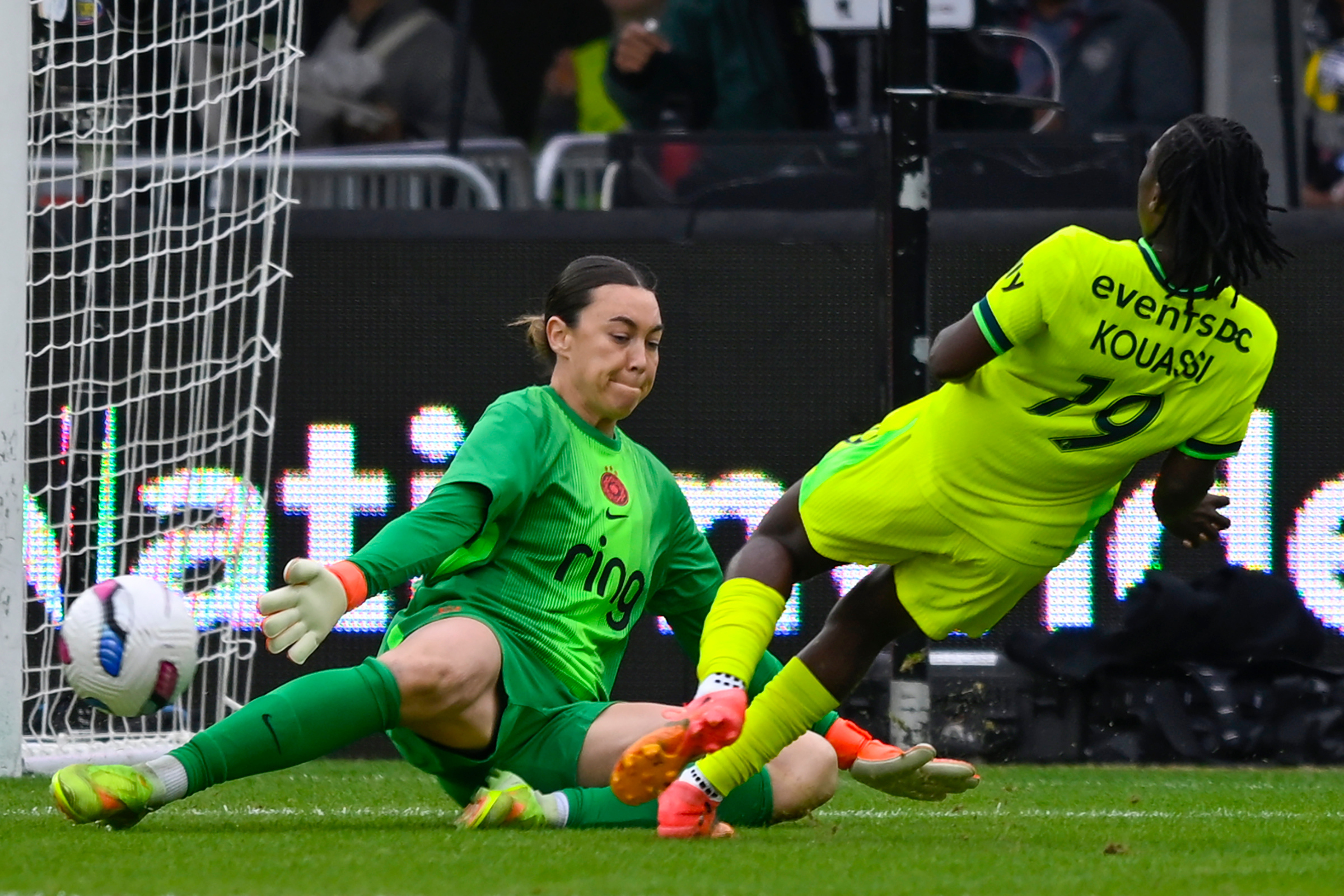 Washington Spirit forward Rosemonde Kouassi (19) plays the ball past Portland Thorns FC goalkeeper Mackenzie Arnold where teammate Gift Monday scored a goal during the first half of a NWSL semifinal women's soccer match, Saturday, Nov. 15, 2025, in Washington.