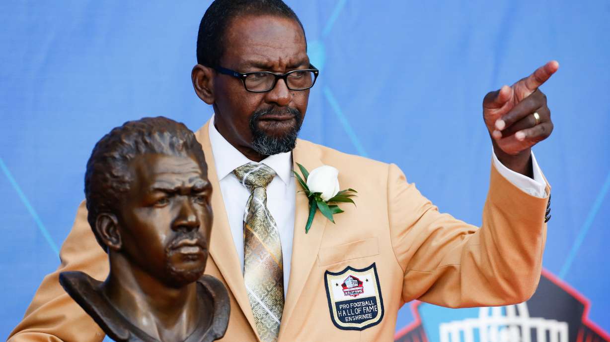 FILE - Former NFL player Kenny Easley poses with a bust of himself during an induction ceremony at the Pro Football Hall of Fame, Saturday, Aug. 5, 2017, in Canton, Ohio.