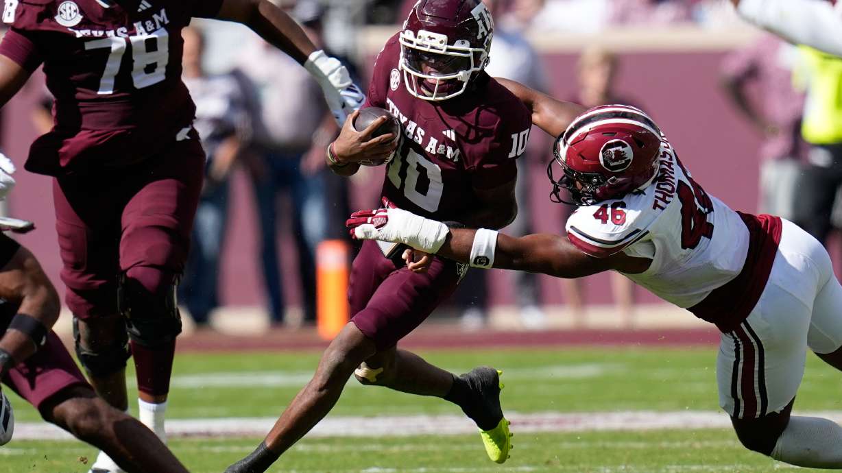 Texas A&M quarterback Marcel Reed (10) is tackled by South Carolina defensive end Bryan Thomas Jr. (46) during the first half of an NCAA college football game Saturday, Nov. 15, 2025, in College Station, Texas.