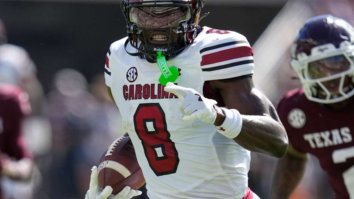 South Carolina wide receiver Nyck Harbor (8) runs for a touchdown after catching a pass as Texas A&M cornerback Dezz Ricks (2) defends during the first half of an NCAA college football game Saturday, Nov. 15, 2025, in College Station, Texas.