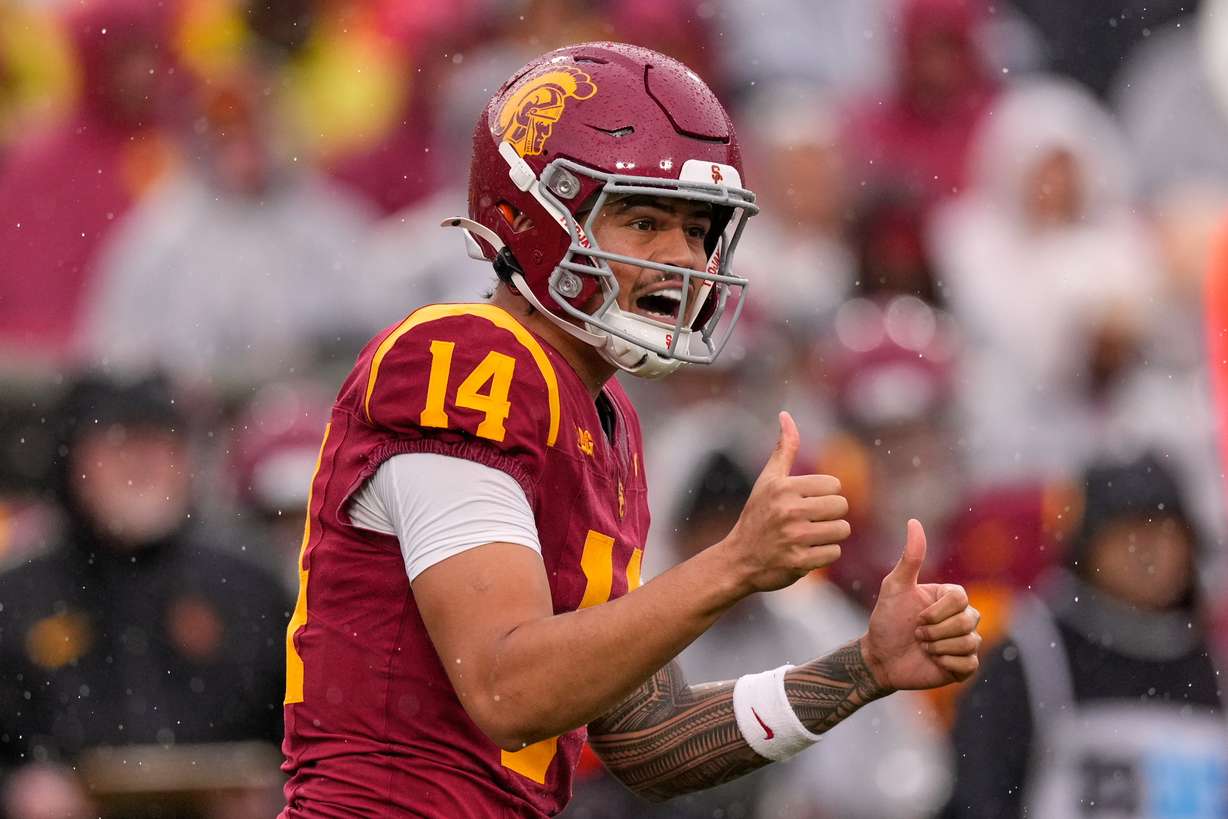 Southern California quarterback Jayden Maiava gestures to teammates during the first half of an NCAA college football game against Iowa, Saturday, Nov. 15, 2025, in Los Angeles.