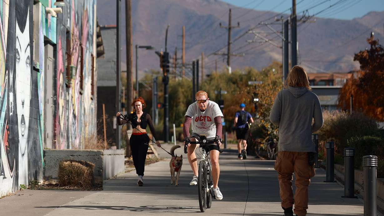 Pedestrians and a cyclist use the S-Line Greenway in Salt Lake City on Nov. 3. The newly proposed Utah Trail Network is aiming to improve transportation in the state.