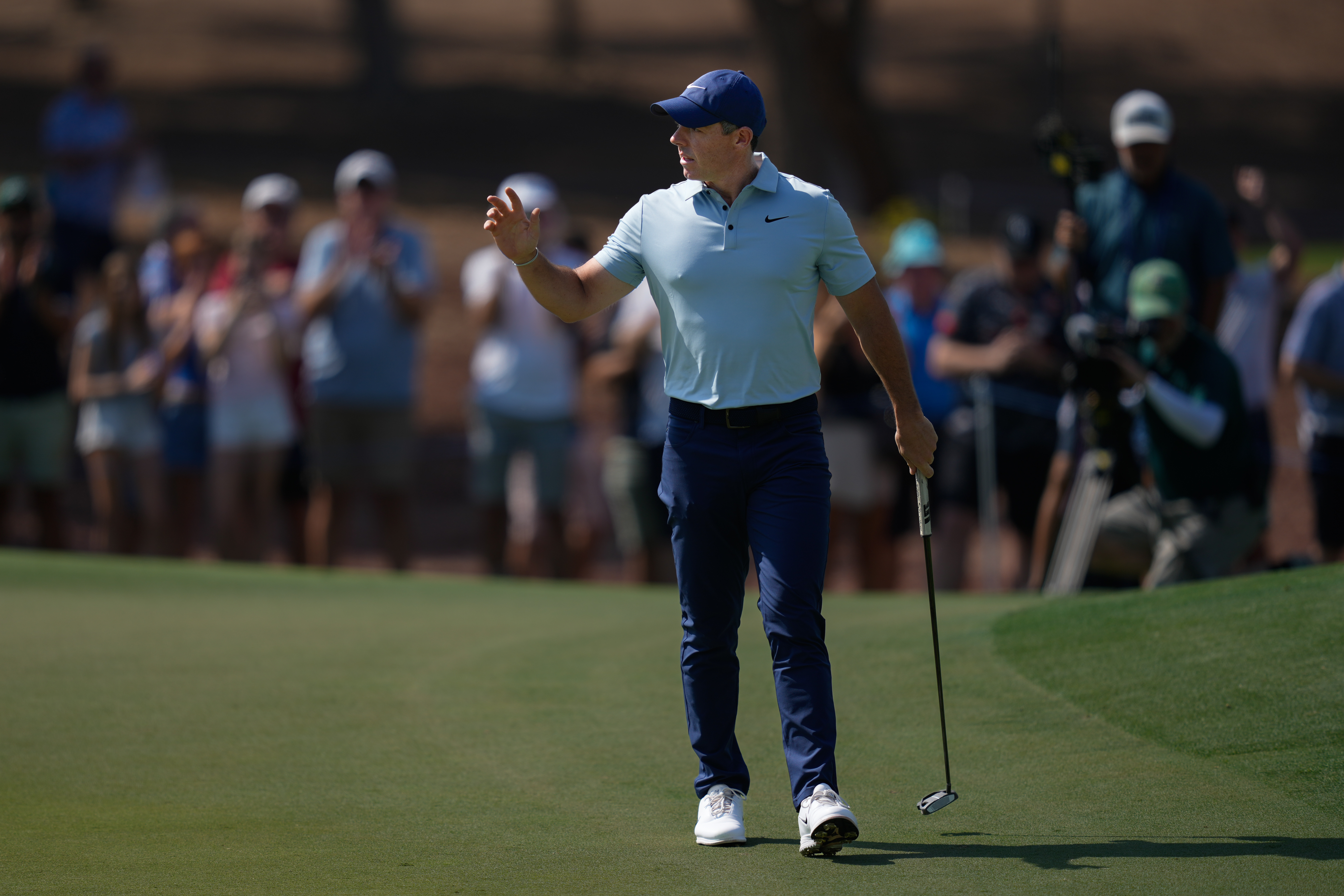 Rory McIlroy of Northern Ireland reacts after a birdie on the 1st hole during the final round of World Tour Golf Championship in Dubai, United Arab Emirates, Sunday, Nov. 16, 2025.