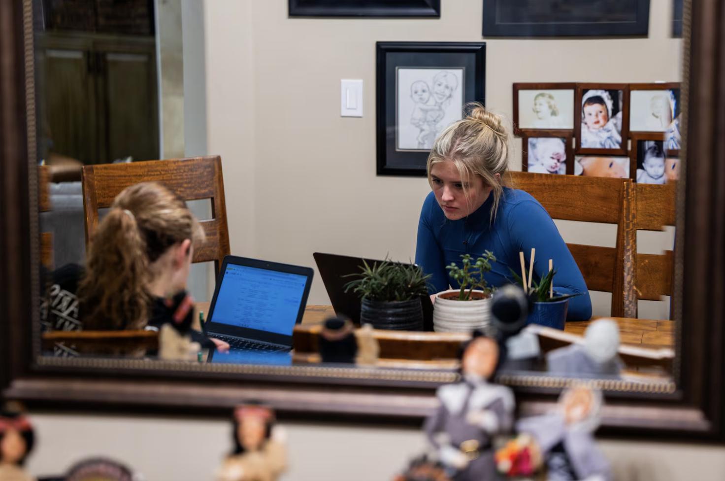 Caroline Long, 13, left, and sister Becca Long, 17, do work for school at their home in Bountiful on Nov. 6.