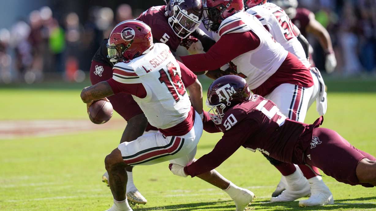 South Carolina quarterback Lanorris Sellers (16) is sacked by Texas A&M defensive end Dayon Hayes (50) during the second half of an NCAA college football game Saturday, Nov. 15, 2025, in College Station, Texas.