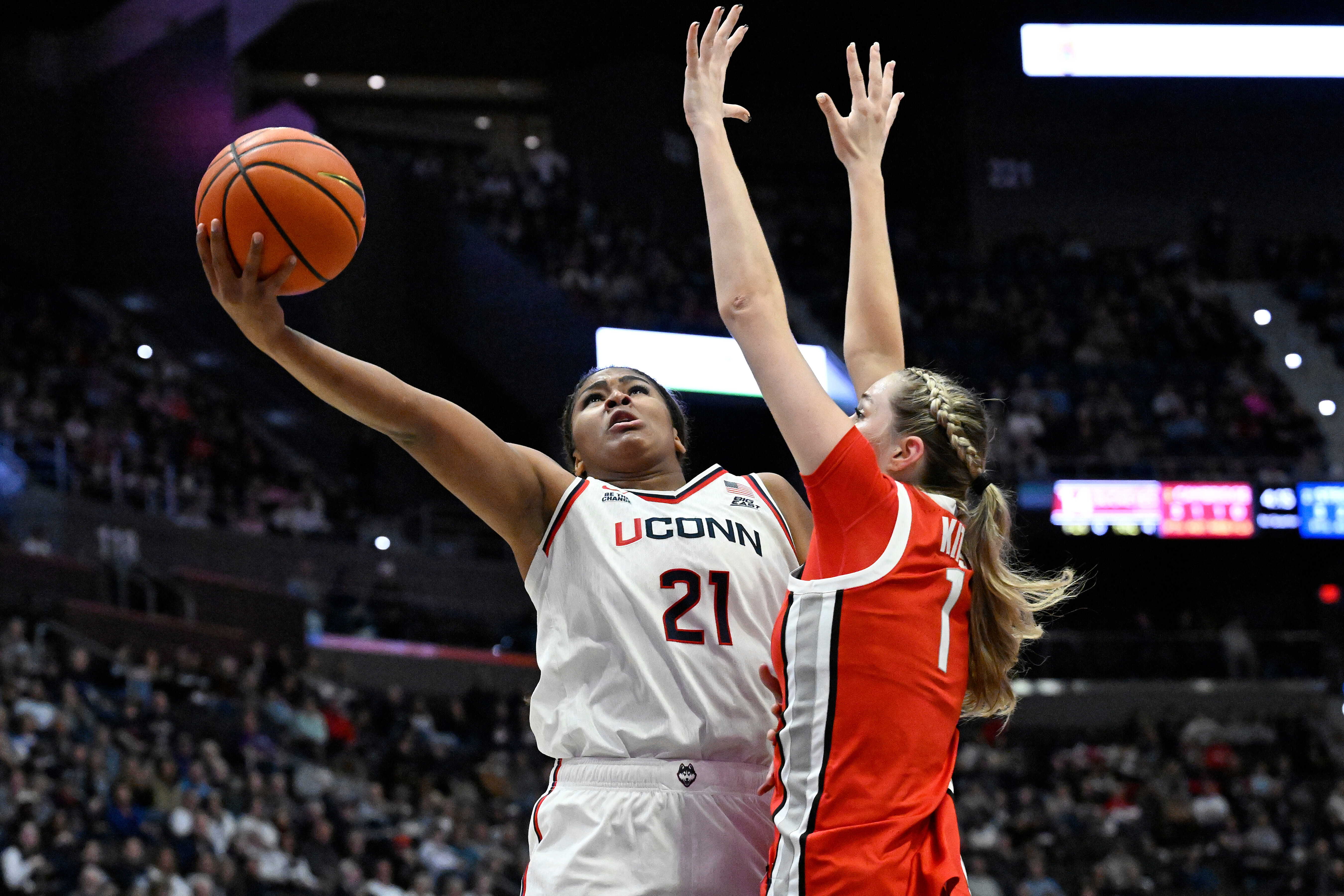 UConn forward Sarah Strong (21) shoots as Ohio State forward Kylee Kitts (1) defends in the first half of an NCAA college basketball game, Sunday, Nov. 16, 2025, in Hartford, Conn.