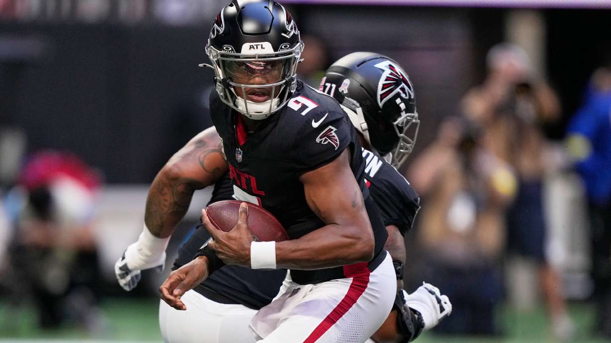 Atlanta Falcons quarterback Michael Penix Jr. (9) drops back against the Carolina Panthers in the first half of an NFL football game, Sunday, Nov. 16, 2025, in Atlanta.