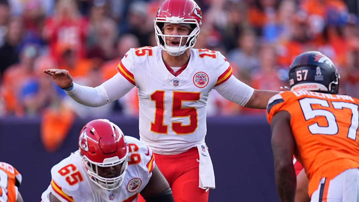 Kansas City Chiefs quarterback Patrick Mahomes (15) calls a play during the first half an NFL football game against the Denver Broncos Sunday, Nov. 16, 2025, in Denver.