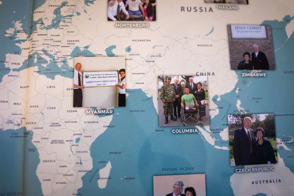 Photos of Kay and Kelvyn Cullimore’s trips while serving their overseas humanitarian mission for The Church of Jesus Christ of Latter-day Saints from 69 years old to 81 years old to is shown in their personal history book at their home in Cottonwood Heights on Nov. 4.