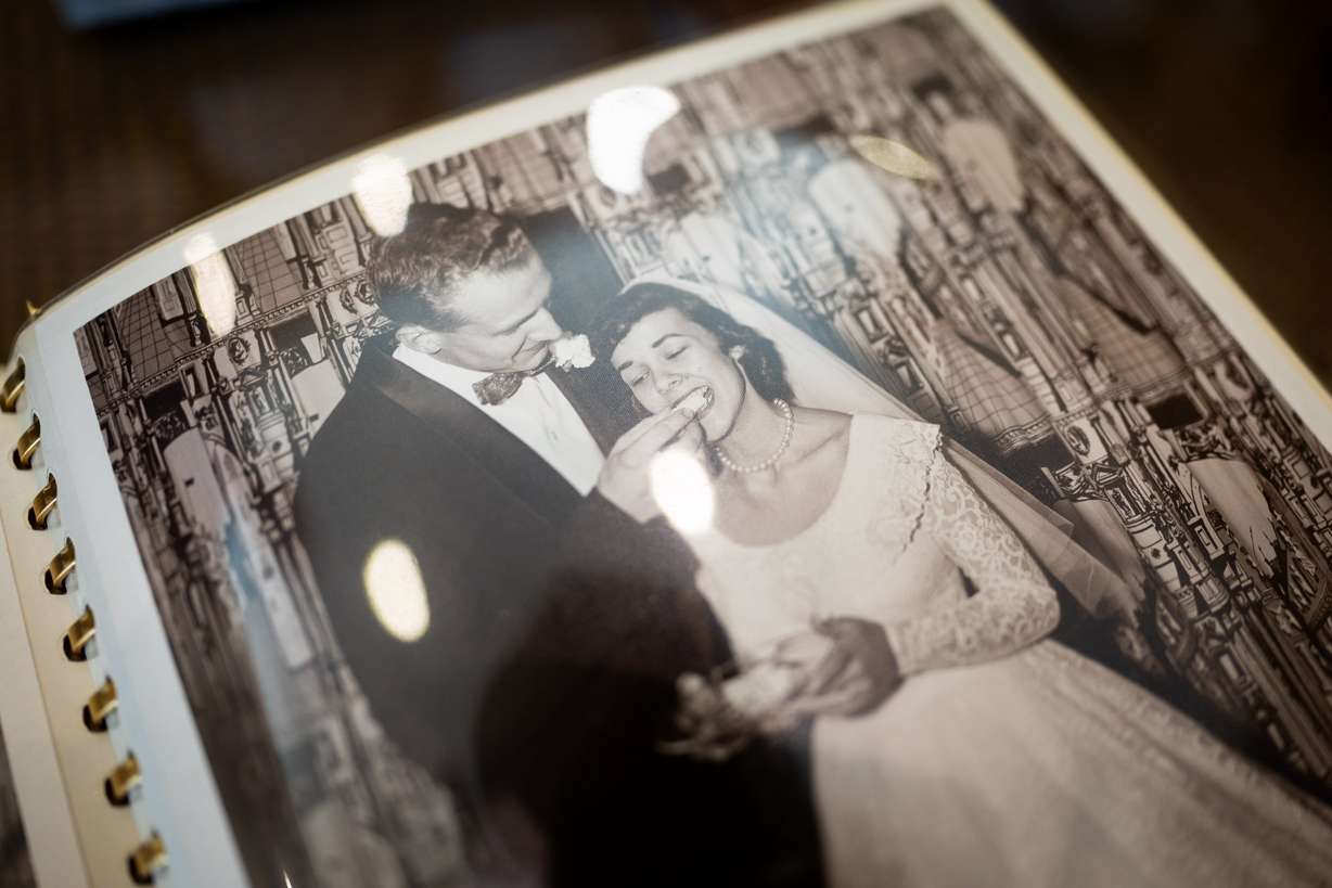 A photo of Kelvyn and Kay Cullimore, married for 70 years, at their wedding reception is shown in a book of photos from their wedding at their home in Cottonwood Heights on Nov. 4.