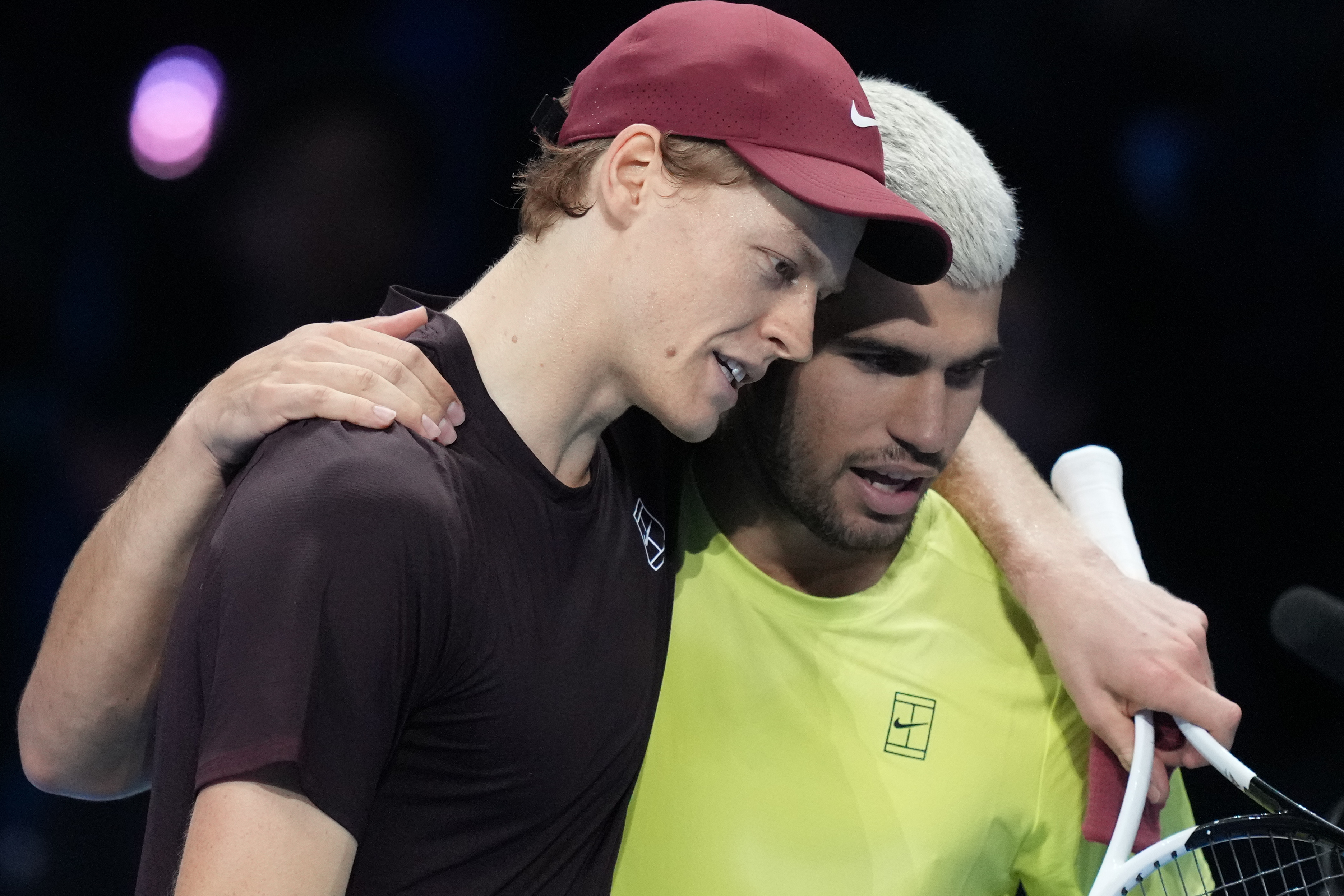 Italy's Jannik Sinner, left, and Spain's Carlos Alcaraz hug after the final tennis match of the ATP World Tour Finals, in Turin, Italy, Sunday, Nov. 16, 2025.