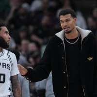 San Antonio's Victor Wembanyama to miss at least 2-3 weeks with strained calf, AP source says