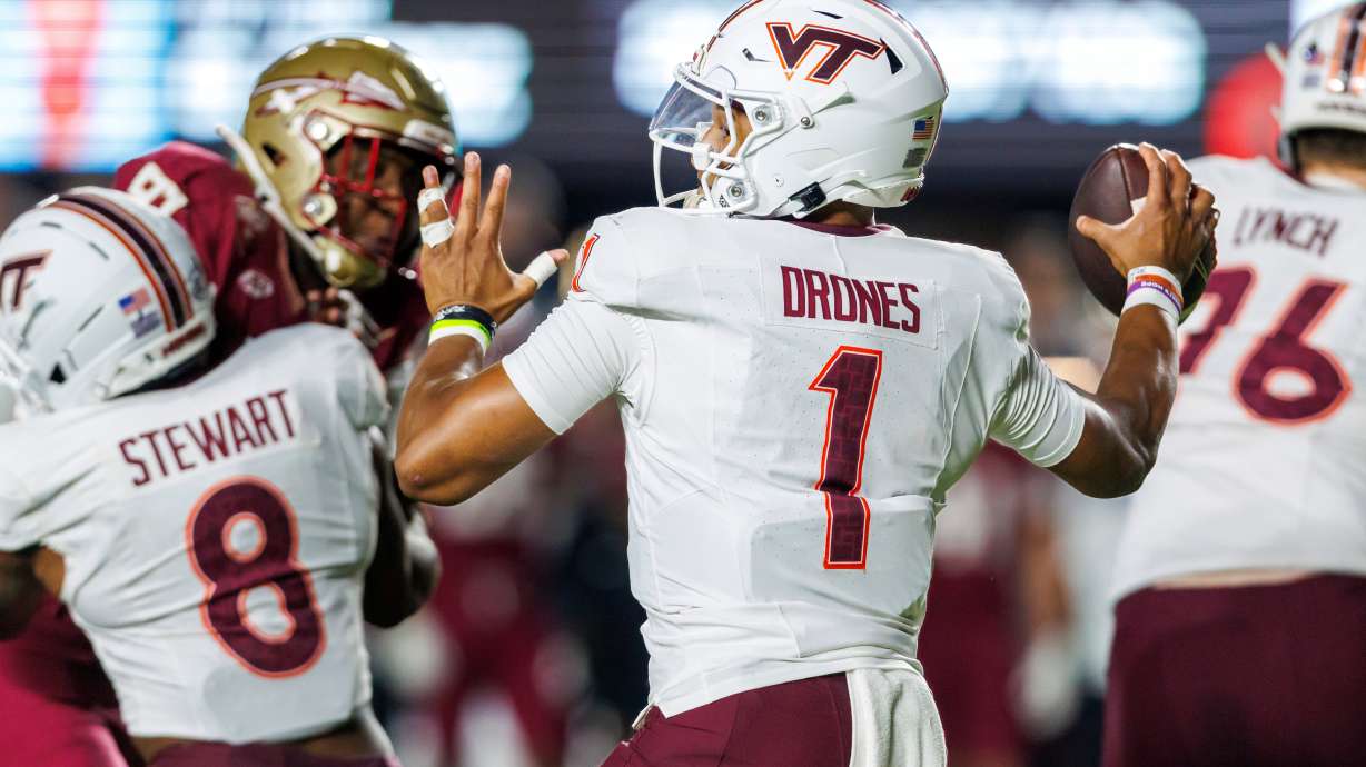Virginia Tech quarterback Kyron Drones (1) looks to pass against Florida State during the first half of an NCAA college football game, Saturday, Nov. 15, 2025, in Tallahassee, Fla.