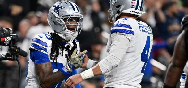 Cowboys honor Kneeland, then get 4 TD passes from Prescott in 33-16 win over Raiders