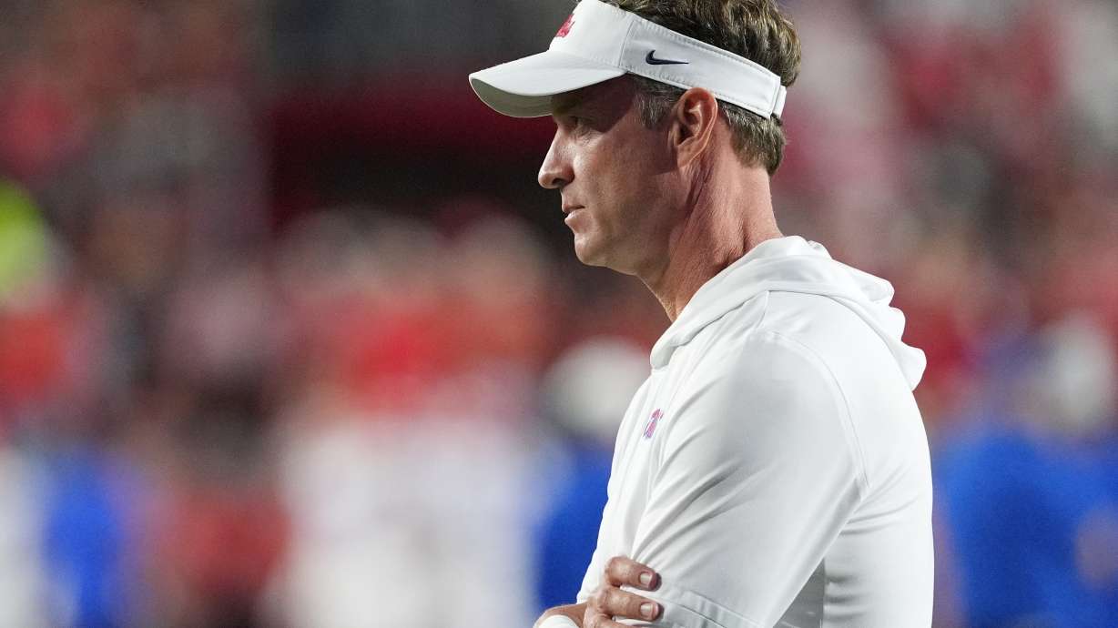 Mississippi head coach Lane Kiffin, watches his team warm up prior to the start of an NCAA college football game against Florida, Saturday, Nov. 15, 2025, in Oxford, Miss.