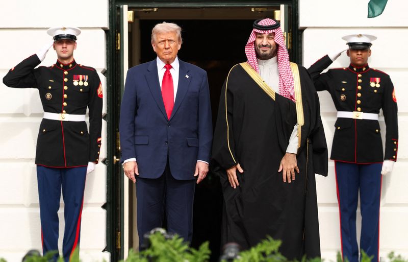 President Donald Trump stands next to Saudi Crown Prince and Prime Minister Mohammed bin Salman during an arrival ceremony on the South Lawn of the White House in Washington, D.C., Tuesday.