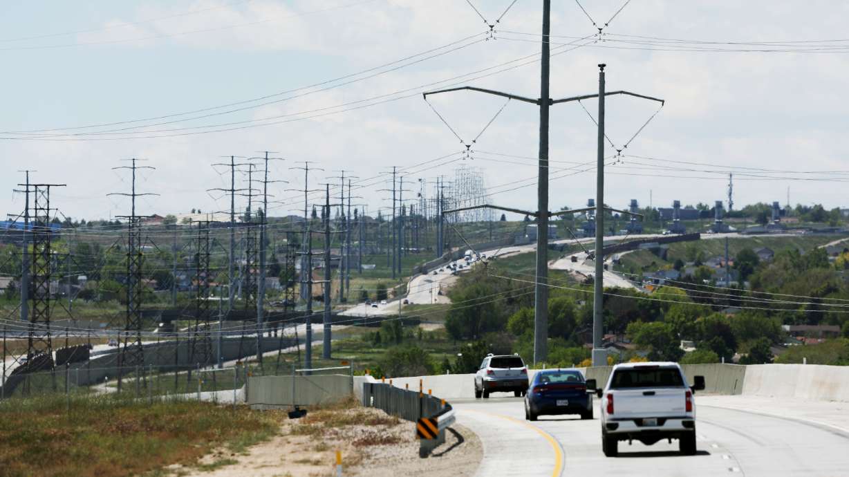 High-tension power lines run along Mountain View Corridor on the west side of the Salt Lake Valley on May 24, 2022. UDOT announced plans for the next phase of converting the highway into a freeway.